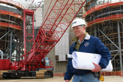 Babcock Wilcox Engineer with Blueprint outside power plant