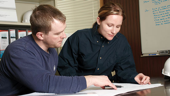 Two Babcock Wilcox engineers reviewing drawing