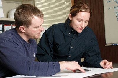Two Babcock Wilcox engineers reviewing drawing