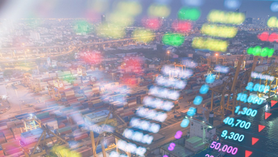 Stock ticker symbols and numbers superimposed over an industrial facility
